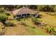 Expansive aerial view of the home showcasing the well-manicured lawn and mature landscaping at 4999 Disston Dr, St Cloud, FL 34771