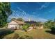 Charming single-story home with solar panels and a landscaped yard at 4999 Disston Dr, St Cloud, FL 34771