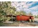 Red barn-style garage or workshop, ample storage space at 4999 Disston Dr, St Cloud, FL 34771