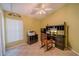 Home office with built-in desk and rocking chair at 4999 Disston Dr, St Cloud, FL 34771