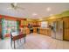 Kitchen with wood cabinets, stainless steel appliances, and tile floors at 4999 Disston Dr, St Cloud, FL 34771