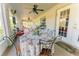 Screened patio with ceiling fans, outdoor seating, and ample natural light, great for entertaining at 4999 Disston Dr, St Cloud, FL 34771