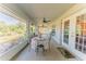 Screened porch with table, chairs, and access to backyard at 4999 Disston Dr, St Cloud, FL 34771