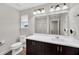 Clean bathroom with single vanity, shower, and tile flooring at 6530 Stoller Ave, Windermere, FL 34786