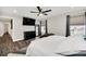 Bedroom with king-size bed, mounted TV, and ample natural light at 6530 Stoller Ave, Windermere, FL 34786