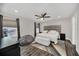 Main bedroom with king-size bed, ceiling fan and large windows at 6530 Stoller Ave, Windermere, FL 34786