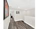 Upstairs hallway with gray flooring and access to bedrooms at 6530 Stoller Ave, Windermere, FL 34786