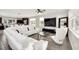 Open living area features a large sectional sofa and a view into the kitchen at 6530 Stoller Ave, Windermere, FL 34786