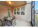 Screened patio with table and chairs, access to backyard at 6530 Stoller Ave, Windermere, FL 34786