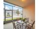 Screened patio with table and chairs, overlooking backyard at 6530 Stoller Ave, Windermere, FL 34786