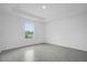 Spacious bedroom with window and tile floor at 661 Lincoln St, Kissimmee, FL 34741
