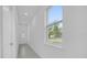 Bright entryway with tiled floor and view to backyard at 661 Lincoln St, Kissimmee, FL 34741