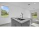 Kitchen island with sink and modern faucet at 661 Lincoln St, Kissimmee, FL 34741