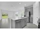 Modern kitchen with gray cabinets and island at 661 Lincoln St, Kissimmee, FL 34741