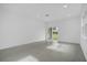 Spacious living room with tiled floor and sliding doors at 661 Lincoln St, Kissimmee, FL 34741