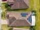 House with solar panels on roof, seen from above at 672 San Joaquin Rd, Kissimmee, FL 34759