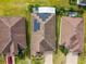 Top-down view of homes featuring solar panels at 672 San Joaquin Rd, Kissimmee, FL 34759