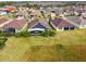 Aerial view of homes with solar panels and a community setting at 672 San Joaquin Rd, Kissimmee, FL 34759