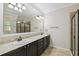 Elegant bathroom with double vanity and large mirror at 672 San Joaquin Rd, Kissimmee, FL 34759
