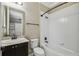 Clean bathroom with a shower/tub combo and dark vanity at 672 San Joaquin Rd, Kissimmee, FL 34759