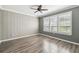 Spacious bedroom with large windows and ceiling fan at 672 San Joaquin Rd, Kissimmee, FL 34759
