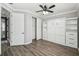Bright bedroom with wood floors and a built-in wall bed at 672 San Joaquin Rd, Kissimmee, FL 34759