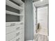 Bright white built-in closet with shelves and drawers at 672 San Joaquin Rd, Kissimmee, FL 34759