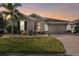 One-story home with stone accents and a two-car garage at 672 San Joaquin Rd, Kissimmee, FL 34759