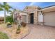 Front entrance of house with stone accents and landscaping at 672 San Joaquin Rd, Kissimmee, FL 34759