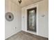 Front entry with decorative door and brick flooring at 672 San Joaquin Rd, Kissimmee, FL 34759