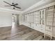 Open living space featuring a built-in entertainment center and hardwood floors at 672 San Joaquin Rd, Kissimmee, FL 34759