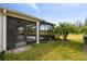 Spacious screened porch with ceiling fan and access to backyard at 672 San Joaquin Rd, Kissimmee, FL 34759