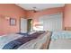 Well-lit bedroom with a large closet and access to a hallway at 8077 Roaring Creek Ct, Kissimmee, FL 34747