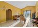 Living room with sliding doors to a view, and vaulted ceilings at 8077 Roaring Creek Ct, Kissimmee, FL 34747