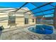 Private kidney-shaped pool with screened enclosure at 8077 Roaring Creek Ct, Kissimmee, FL 34747