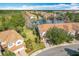Aerial view of community showing townhome and lake at 8318 Quimby Cir, Davenport, FL 33896