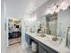 Double vanity bathroom with walk-in shower and closet at 8318 Quimby Cir, Davenport, FL 33896
