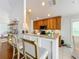Modern kitchen features a breakfast bar with granite countertops at 8318 Quimby Cir, Davenport, FL 33896