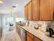 Kitchen with stainless steel appliances and wood cabinets at 8318 Quimby Cir, Davenport, FL 33896