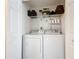 Laundry room with washer, dryer, and shelving at 8318 Quimby Cir, Davenport, FL 33896