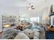 Open living space with a neutral color scheme and hardwood floors at 8318 Quimby Cir, Davenport, FL 33896