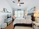 Spacious main bedroom with king bed and window at 8318 Quimby Cir, Davenport, FL 33896