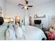 Main bedroom with king-size bed and access to bathroom at 8318 Quimby Cir, Davenport, FL 33896