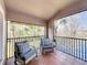 Enjoy peaceful screened balcony overlooking lush greenery at 8318 Quimby Cir, Davenport, FL 33896