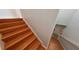 Wooden staircase leading to the upper floor of the home at 8318 Quimby Cir, Davenport, FL 33896