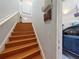 Interior stairs with access to garage and upper floor at 8318 Quimby Cir, Davenport, FL 33896