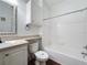 Bathroom featuring a tub, toilet, and vanity with mirror at 8803 Dunes Ct # 306, Kissimmee, FL 34747