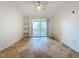 Bright bedroom with ceiling fan and wood-look tile floor at 8803 Dunes Ct # 306, Kissimmee, FL 34747