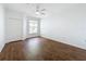 Spacious bedroom with ceiling fan and wood-look tile floor at 8803 Dunes Ct # 306, Kissimmee, FL 34747