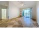 Spacious bedroom with tile floors and access to bathroom at 8803 Dunes Ct # 306, Kissimmee, FL 34747